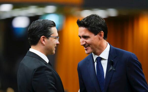 Prime Minister Justin Trudeau and Conservative Leader Pierre Poilievre greet each other as MPs gather in the House of Commons to pay tribute to Queen Elizabeth, in Ottawa II on Sept. 15, 2022. (The Canadian Press/Sean Kilpatrick)