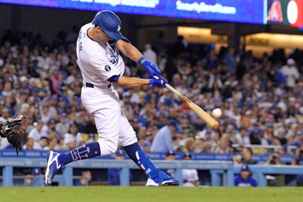 Los Angeles Dodgers' Chris Taylor hits a three-run home run during the fourth inning of a baseball game against the Arizona Diamondbacks in Los Angeles, on Sept. 19, 2022. (Mark J. Terrill/AP Photo)