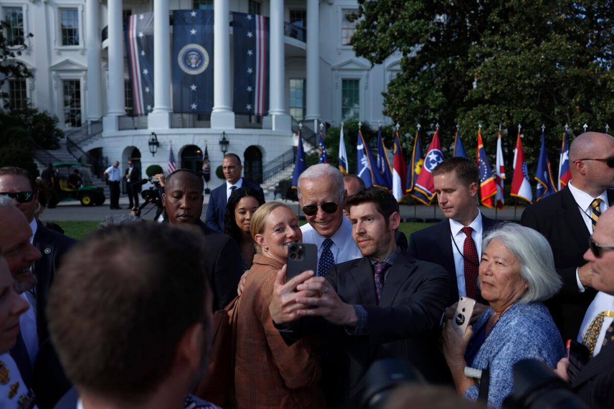 President Joe Biden takes pictures with guests after speaking at an event celebrating the passage of the Inflation Reduction Act on the South Lawn of the White House on Sept. 13, 2022. (Anna Moneymaker/Getty Images)