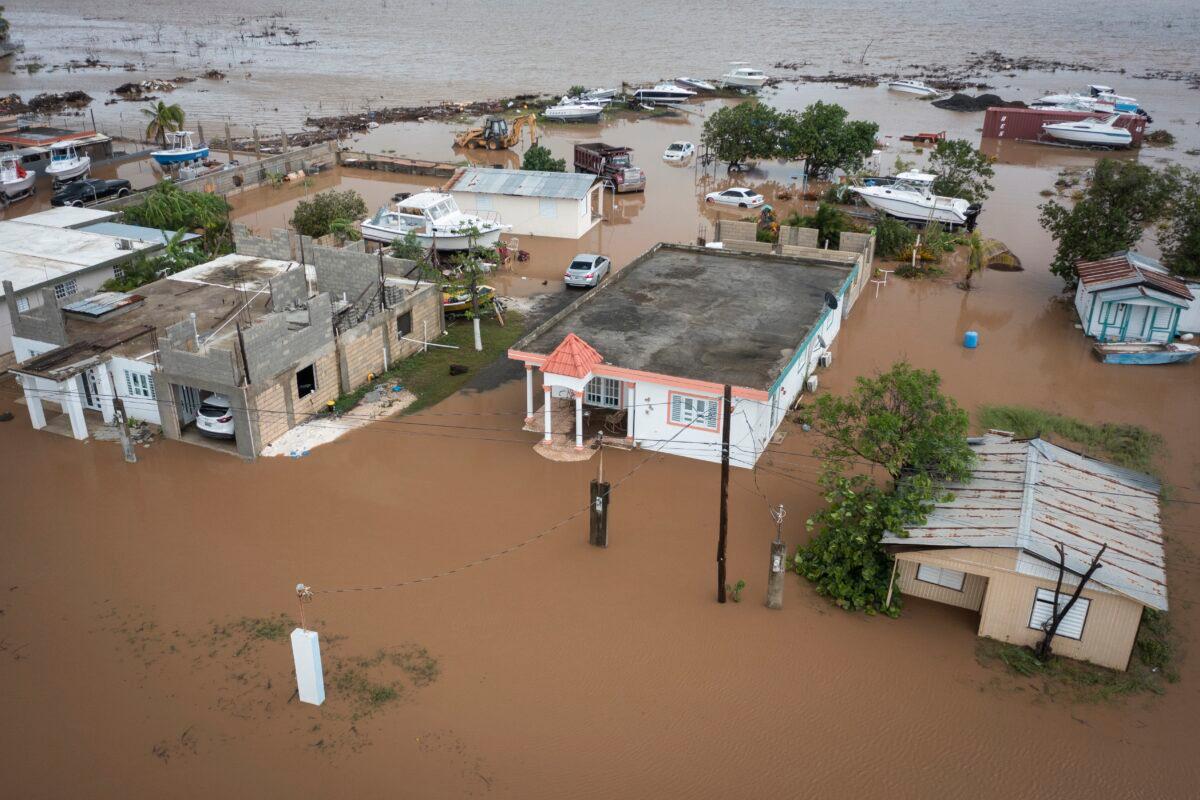 Homes are flooded on Salinas Beach after the passing of Hurricane Fiona in Salinas, Puerto Rico, on Sept. 19, 2022. (Alejandro Granadillo/AP Photo)