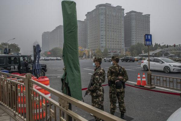 Soldiers and police stand guard near Tiananmen Square in Beijing, on Nov. 5, 2021. (Gilles Sabrie/Bloomberg via Getty Images)