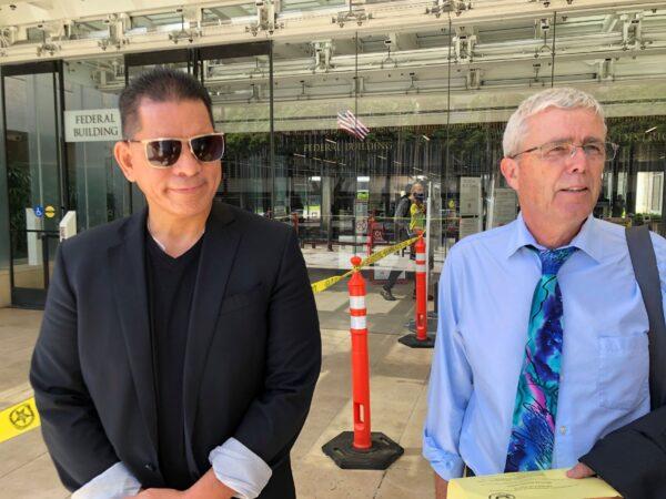 Stewart Olani Stant (L), listens as his attorney Cary Virtue speaks to reporters outside U.S. District Court in Honolulu, Hawaii on Sept. 19, 2022. (Audrey McAvoy/AP Photo)