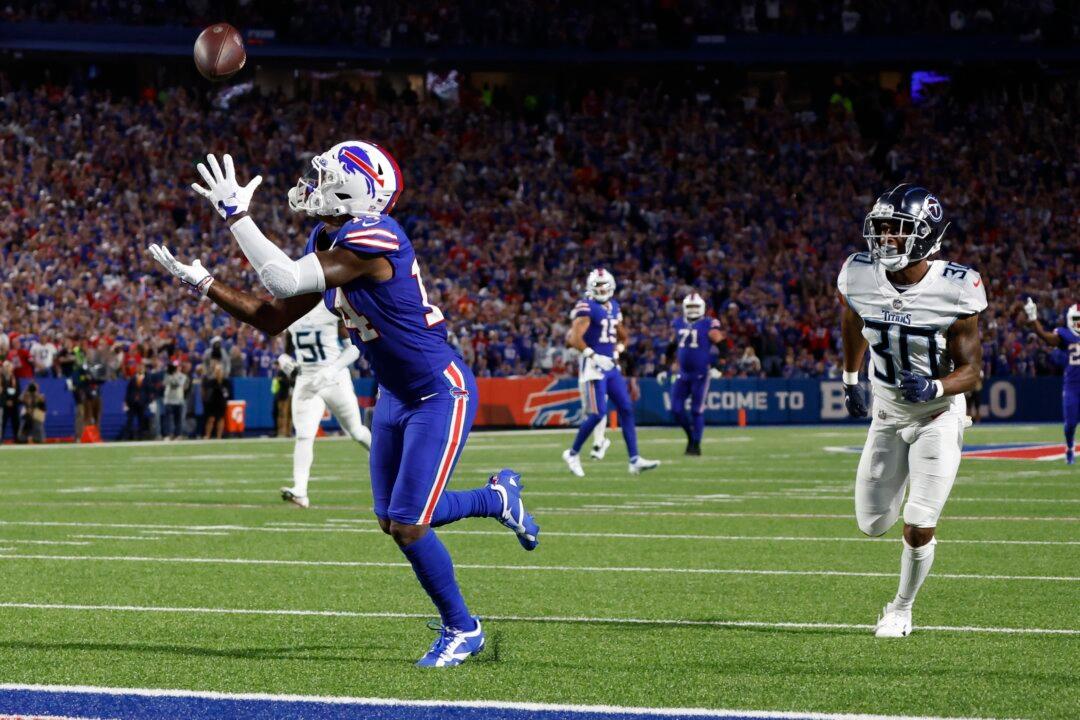 Diggs Scores 3 TDs for Bills in 41–7 Rout of Titans