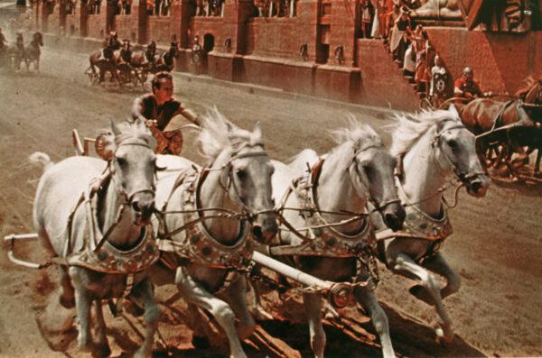 Charlton Heston as Judah Ben-Hur in the chariot race that kept audiences on the edge of their seats in "Ben-Hur." (MovieStillsDB)