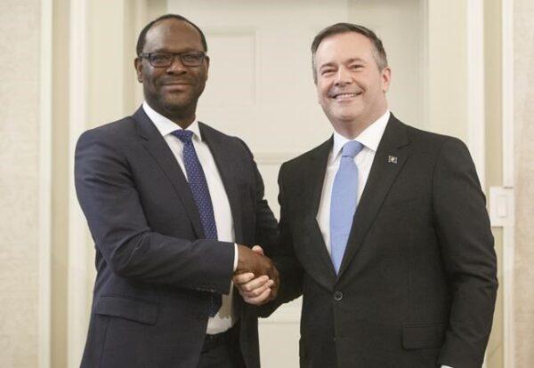 Alberta premier Jason Kenney shakes hands with Kaycee Madu, Minister of Municipal Affairs after being sworn into office in Edmonton on April 30, 2019. (The Canadian Press/Jason Franson)