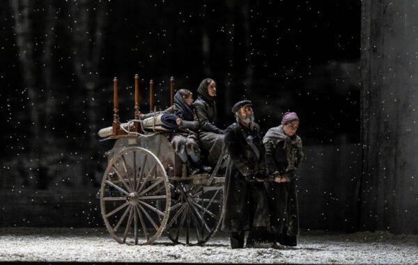 (L–R) Two of Tevye's daughter in the wagon with Steven Skybell as Tevye and Debbie Gravitte as Golde sing "Anatevka" in the Lyric Opera's production of "Fiddler on the Roof." (Todd Rosenberg)