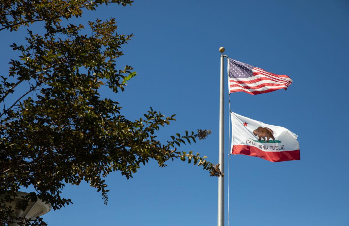 Flags fly at the Newport-Mesa Unified School District in Costa Mesa, Calif., on Sept. 21, 2022. (John Fredricks/The Epoch Times)