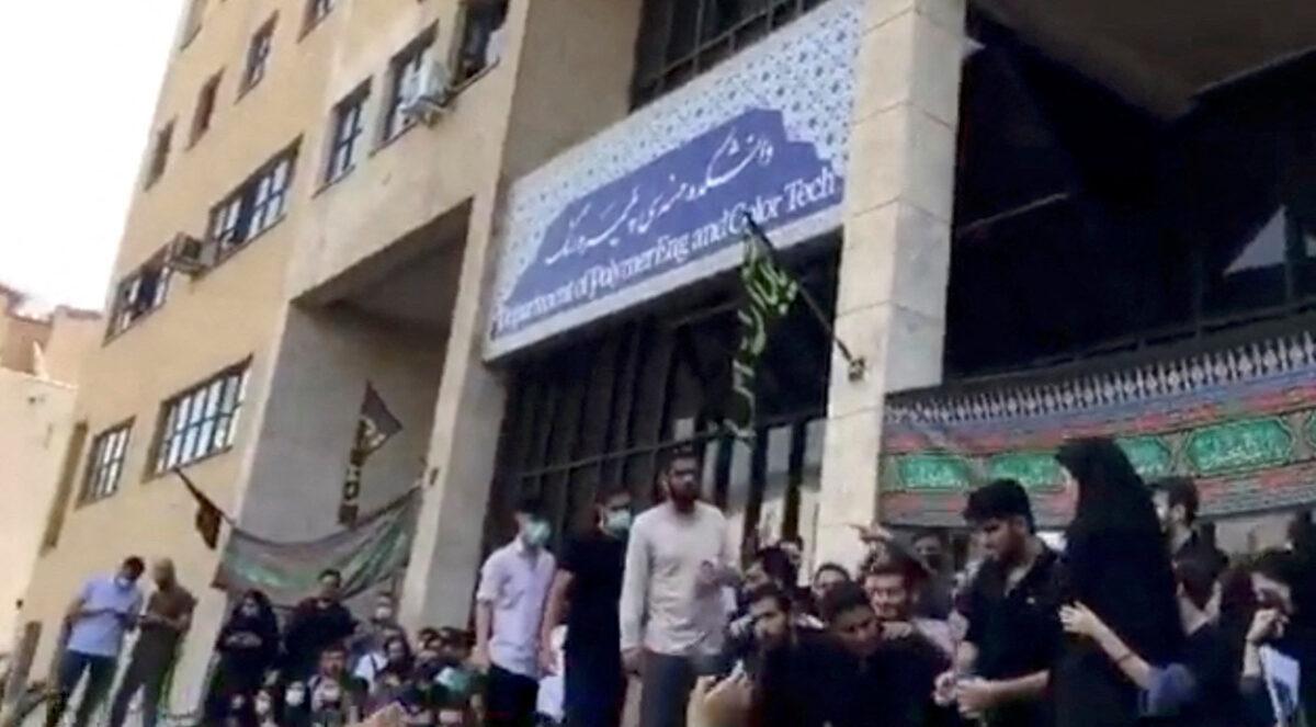 People protest outside Tehran's Amirkabir University of Technology following death of a woman in custody, in Tehran, Iran, on Sept. 19, 2022, in this still image taken from a video obtained by Reuters. (Reuters)