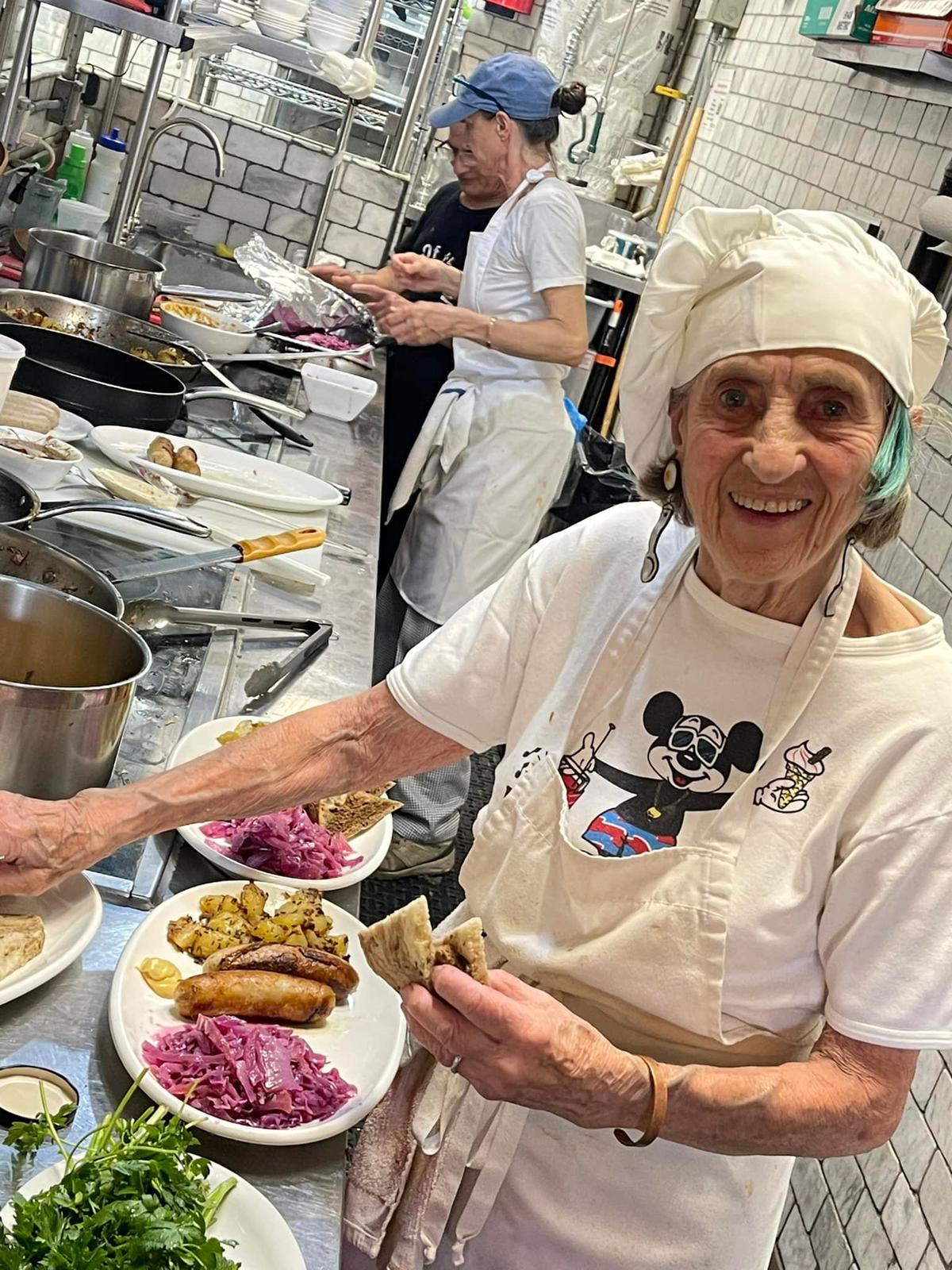 Nonna Nancy making weisswurst. (Courtesy of <a href="https://www.enotecamaria.com/">Jody Scaravella</a>)