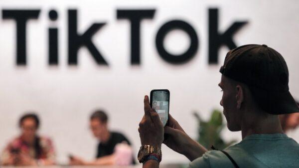 A visitor makes a photo at the TikTok exhibition stands at the Gamescom computer gaming fair in Cologne, Germany, on Aug. 25, 2022. (Martin Meissner, The Canadian Press/AP)