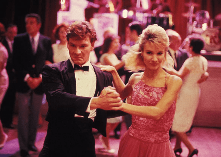 Johnny Castle (Patrick Swayze) and Penny Johnson (Cynthia Rhodes) strut their stuff for the crowd, in "Dirty Dancing." (Artisan entertainment/Vestron Pictures)