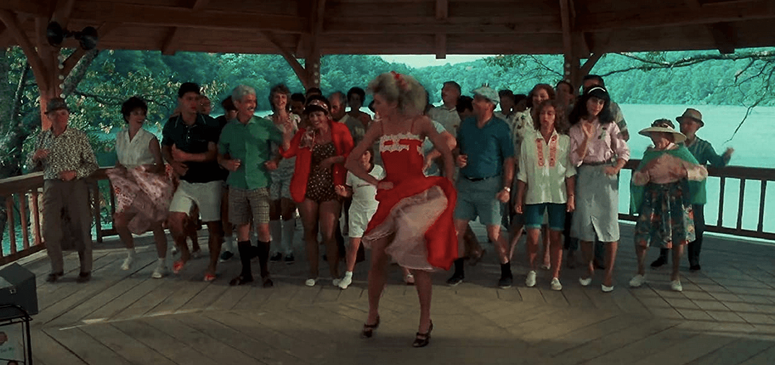 Penny Johnson (Cynthia Rhodes, front and center in red) leads a dance class at the Kellerman resort, in "Dirty Dancing." (Artisan entertainment/Vestron Pictures)