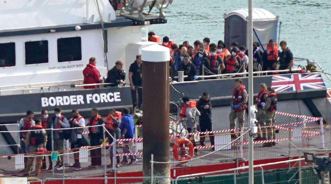 A group of illegal immigrants are brought ashore at Dover, Kent, from a Border Force vessel following a small-boat incident in the English Channel on Sept. 22, 2022. (Gareth Fuller/PA Media)