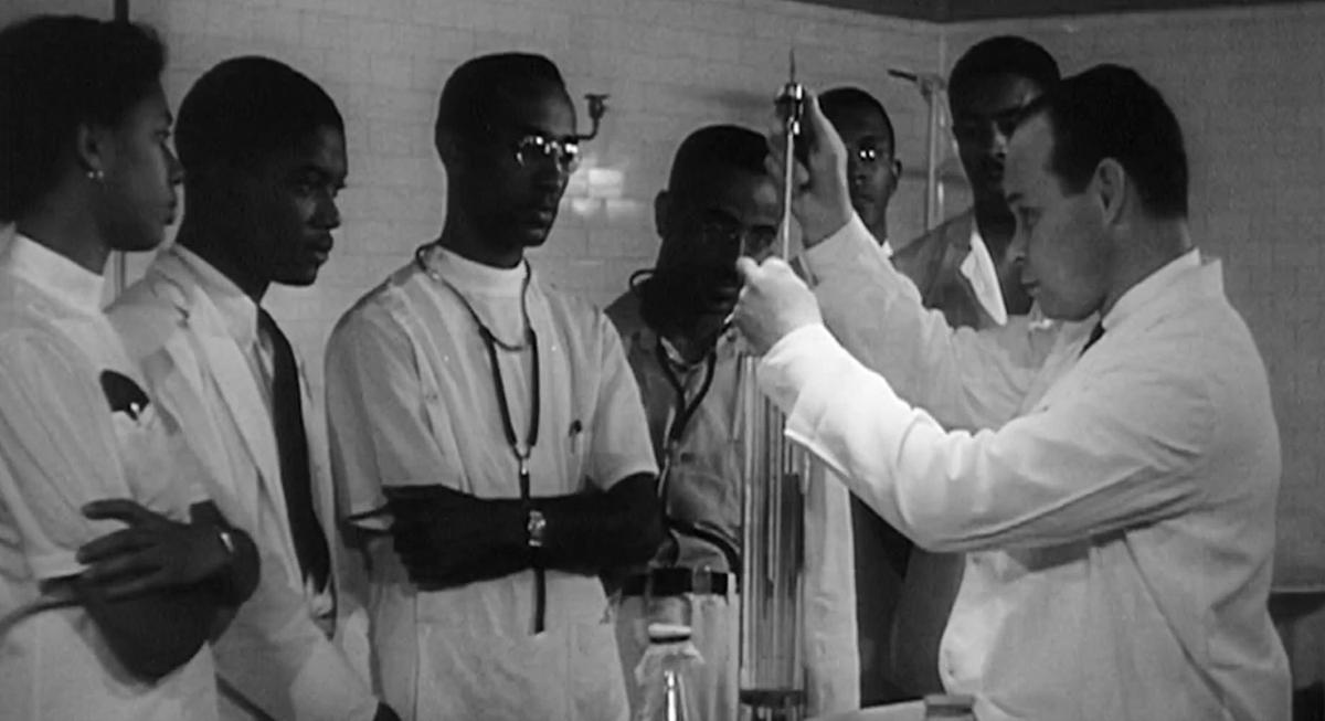 A 1950s film clip describes Howard University (a black college in Washington D.C.) as having one of the best medical schools in the country. “Great American Race Game” (Fast Car Films)