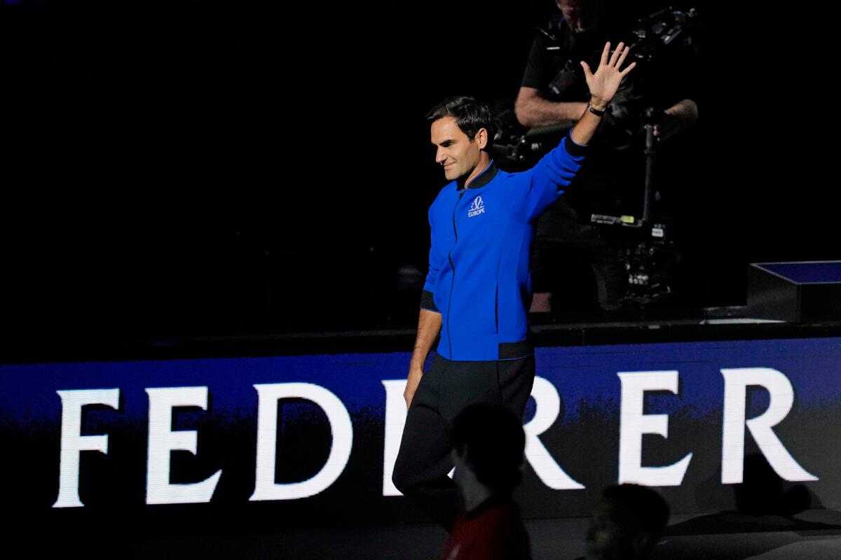 Team Europe's Roger Federer of Switzerland waves during the opening ceremony of the Laver Cup tennis tournament at the O2 in London on Sept. 23, 2022. (Kin Cheung/AP Photo)