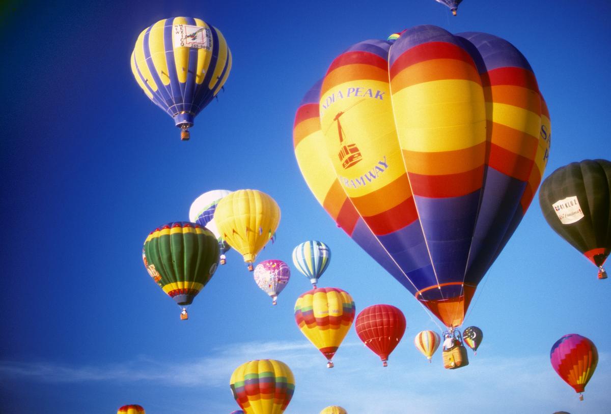 Hot air balloons against blue sky, International Balloon Festival, Albuquerque, New Mexico. (Dreamstime)