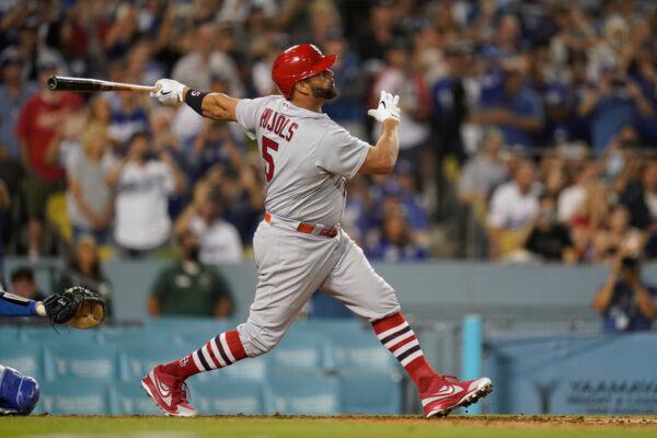 St. Louis Cardinals designated hitter Albert Pujols (5) hits a home run during the fourth inning of a baseball game against the Los Angeles Dodgers in Los Angeles, on Sept. 23, 2022. (Ashley Landis/AP Photo)