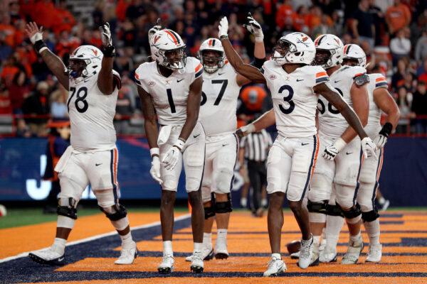 Virginia Cavaliers celebrate after scoring a touchdown during the fourth quarter against the Syracuse Orange at JMA Wireless Dome in Syracuse, N.Y., Sept. 23, 2022. (Bryan M. Bennett/Getty Images)