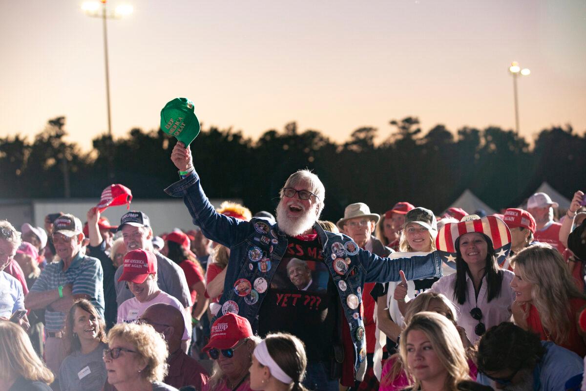 People cheer before a Save America rally at the Aero Center Wilmington, in Wilmington, North Carolina, on Sept. 23, 2022. (Allison Joyce/Getty Images)