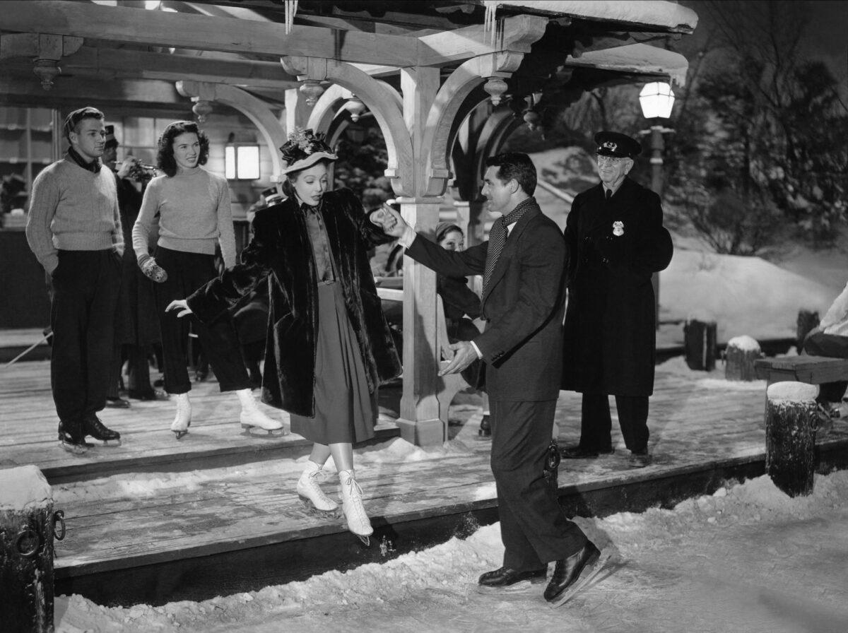 Loretta Young as the wife of the bishop goes skating with Cary Grant as the mysterious visitor Dudley in "The Bishop's Wife." (MovieStillsDB)