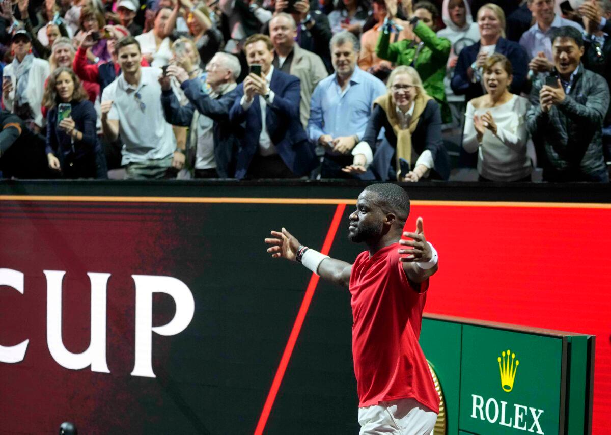 Team World's Frances Tiafoe celebrates after winning the singles tennis match against Team Europe's Stefanos Tsitsipas on the third day of the Laver Cup tennis tournament at the O2 arena in London on Sept. 25, 2022. (Kin Cheung/AP Photo)