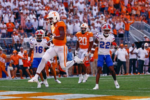 Tennessee quarterback Hendon Hooker (5) leaps over the goal line for a touchdown during the first half of an NCAA college football game against Florida in Knoxville, Tenn., Sept. 24, 2022. (Wade Payne/AP Photo)