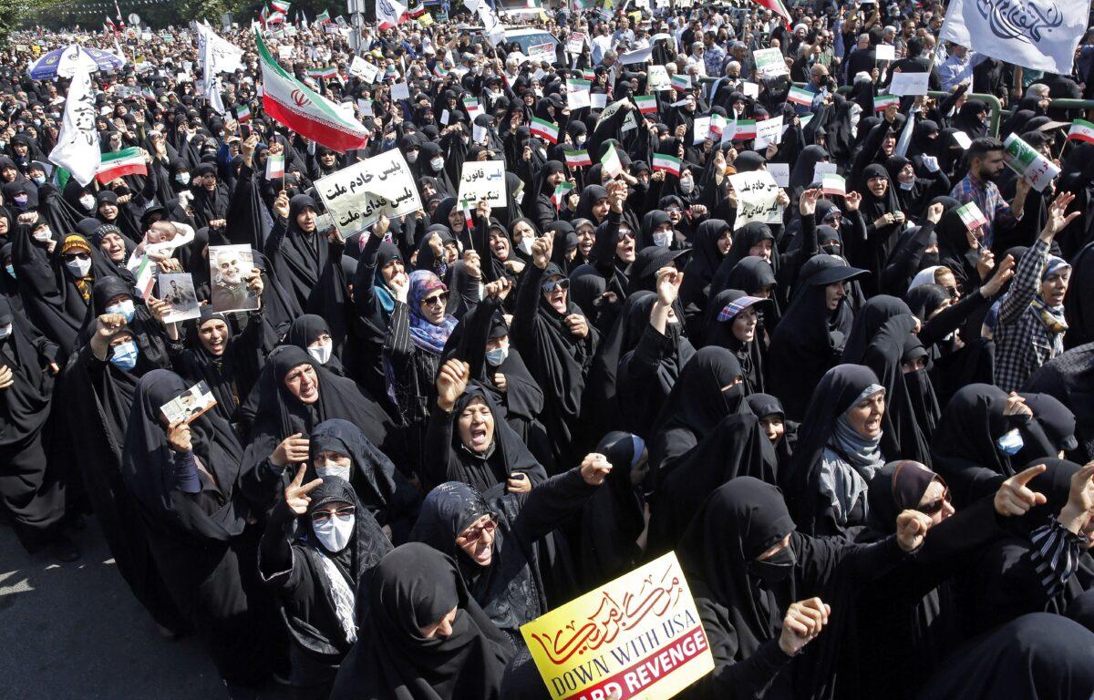 Iranians march during a pro-hijab rally in the capital Tehran on Sept. 23, 2022. (AFP via Getty Images)