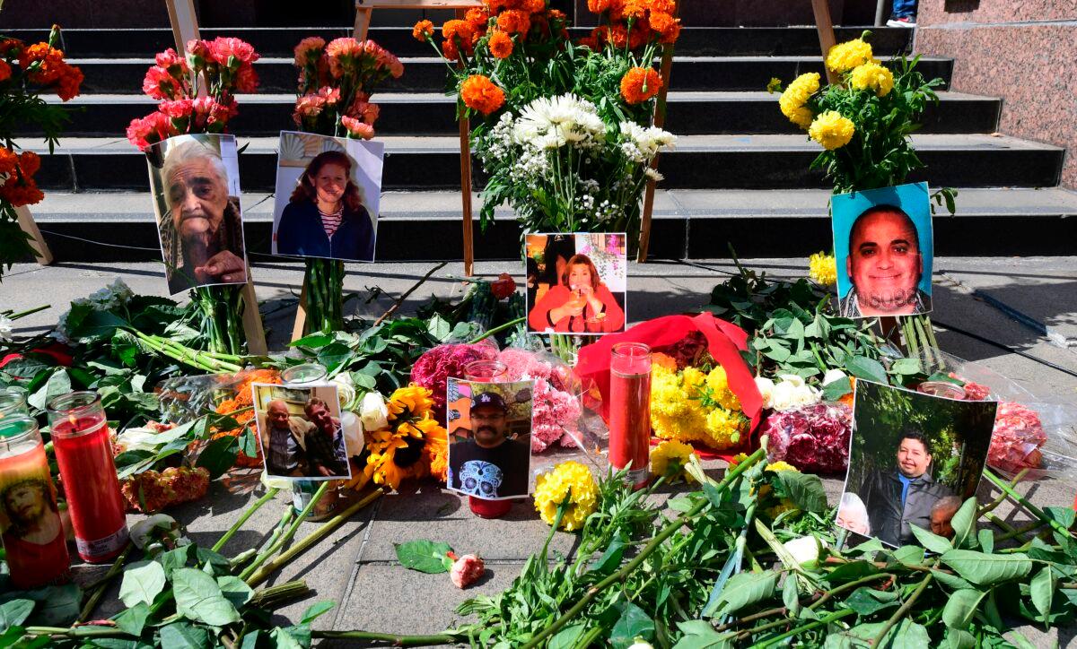 Flowers, candles, and photographs are placed at a memorial honoring residents of Los Angeles who lost their lives to coronavirus in Los Angeles on Aug. 31, 2020. (Frederic J. Brown/AFP via Getty Images)