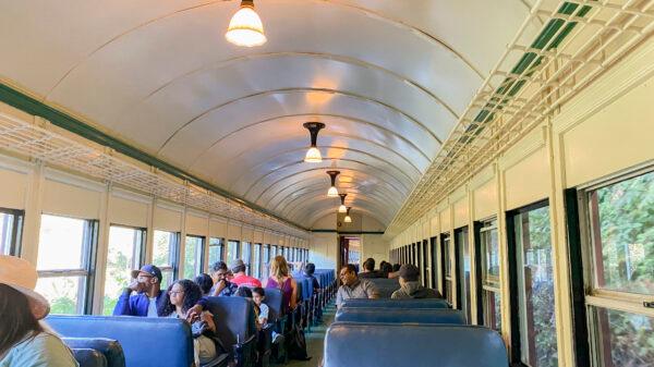 Passengers ride in a car on the Skunk Train on Sept. 4, 2022. (Ilene Eng/The Epoch Times)