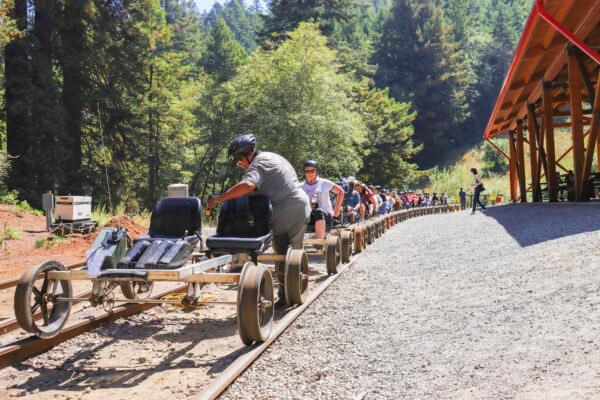 People get back on railbikes after a break at Glen Blair Junction in Fort Bragg, Calif., on Sept. 4, 2022. (Cynthia Cai/The Epoch Times)