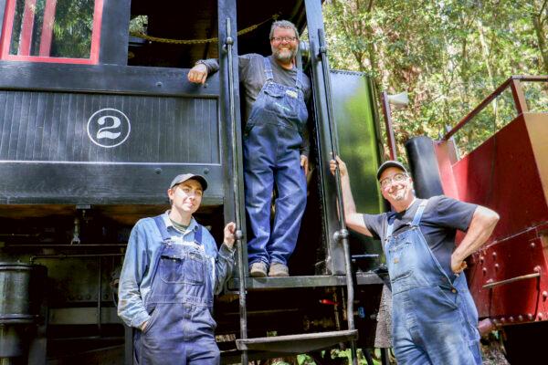 The crew including Stathi Pappas (R) and John Graddon (C) on the Skunk Train in Fort Bragg, Calif., on Sept. 4, 2022. (Cynthia Cai/The Epoch Times)