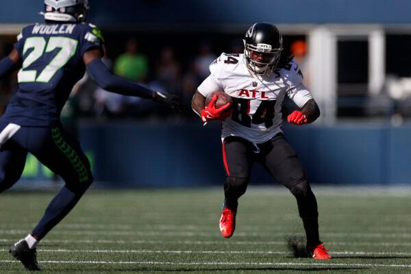 Cordarrelle Patterson #84 of the Atlanta Falcons runs with the ball against the Seattle Seahawks during the third quarter at Lumen Field in Seattle on Sept. 25, 2022. (Steph Chambers/Getty Images)