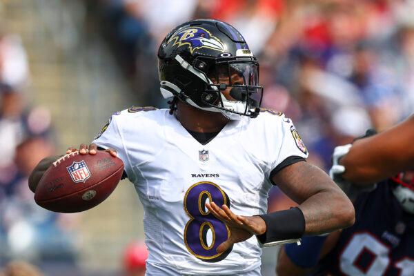 Quarterback Lamar Jackson #8 of the Baltimore Ravens attempts a pass during the second half against the New England Patriots at Gillette Stadium in Foxborough, Mass., on Sept. 25, 2022. (Adam Glanzman/Getty Images)
