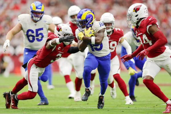 Brandon Powell (19) of the Los Angeles Rams runs with the ball after a reception against Budda Baker (3) of the Arizona Cardinals during the first quarter at State Farm Stadium in Glendale, Ariz., on Sept. 25, 2022. (Christian Petersen/Getty Images)