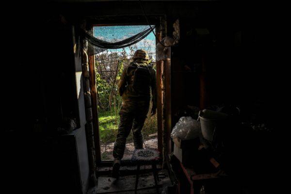 A Ukrainian soldier stays covered in Bakhmut, Donetsk region of Ukraine, on Sept. 25, 2022, amid the Russian invasion of Ukraine. (Juan Barreto/AFP via Getty Images)
