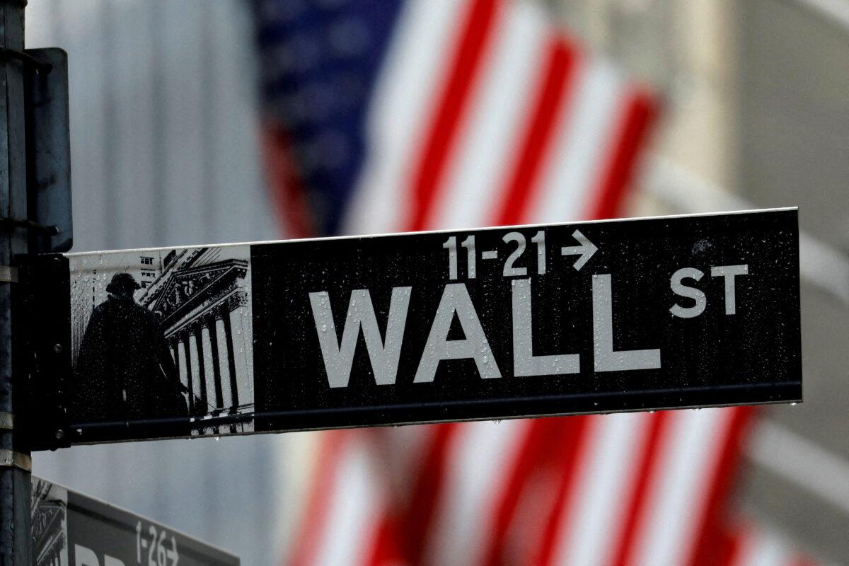 Raindrops hang on a sign for Wall Street outside the New York Stock Exchange on Oct. 26, 2020. (Mike Segar/Reuters)