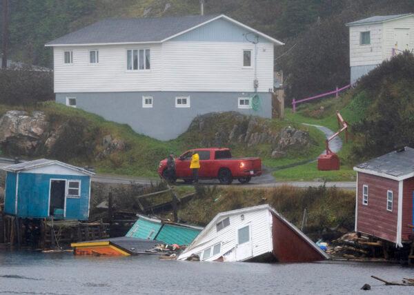 Buildings sit in the water along the shore following hurricane Fiona in Rose Blanche-Harbour Le Cou, Newfoundland and Labrador, on Sept. 27, 2022. (Frank Gunn/The Canadian Press)