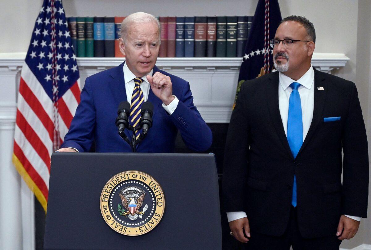 President Joe Biden announces student loan relief with Education Secretary Miguel Cardona on Aug. 24, 2022. (Oliver Douliery/AFP via Getty Images)