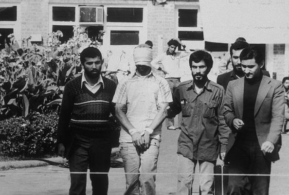 An American hostage being paraded before the cameras by his Iranian captors. (MPI/Getty Images)