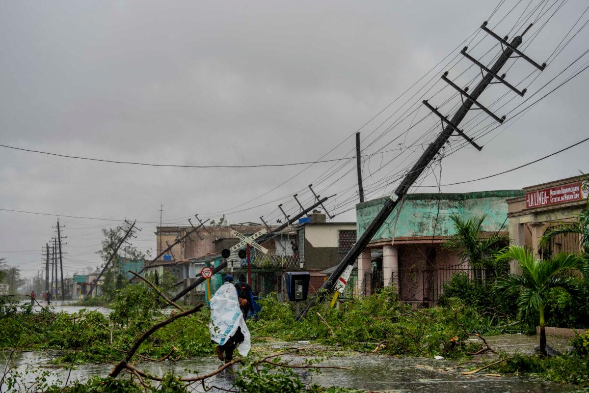 Fallen utility poles and fallen branches line a street after Hurricane Ian hit Pinar del Rio, Cuba, on Sept. 27, 2022. (Ramon Espinosa/AP Photo)