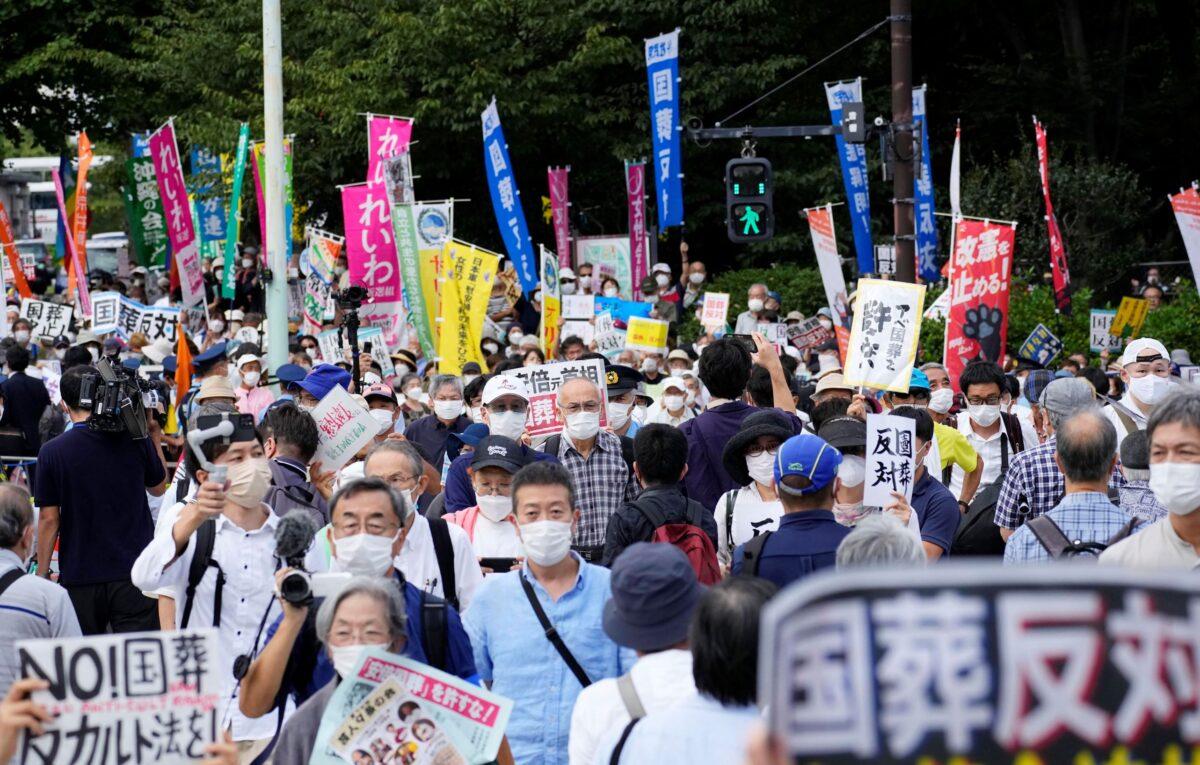A street near the parliament is packed with protesters against a state funeral for Japan's former Prime Minister Shinzo Abe, in Tokyo on Sept. 27, 2022. (Kyodo News via AP)