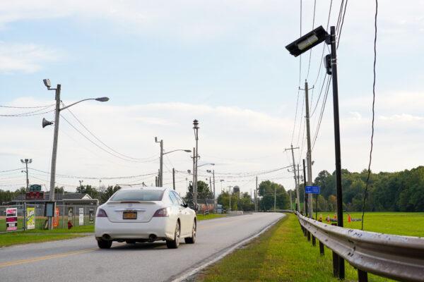 A car passes a newly installed license plate reading camera on the Finchville Turnpike in Mount Hope, N.Y., on September 25, 2022. (Cara Ding/The Epoch Times)