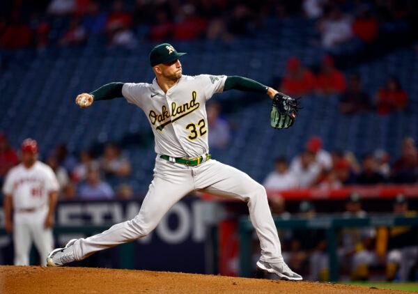 James Kaprielian (32) of the Oakland Athletics throws against the Los Angeles Angels in the first inning at Angel Stadium of Anaheim, in Anaheim, Calif., on Sept. 27, 2022. (Ronald Martinez/Getty Images)
