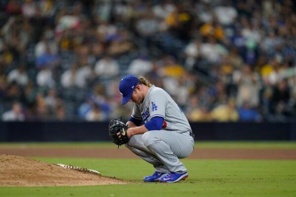 Los Angeles Dodgers relief pitcher Craig Kimbrel takes a moment before facing a San Diego Padres batter during the 10th inning of a baseball game in San Diego on Sept. 27, 2022. (Gregory Bull/AP Photo)