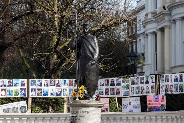 Memorials and floral tributes, dedicated to protesters who were killed in recent clashes with security forces in Kyiv, surround a statue of "Vladimir the Great," the Grand Prince of Kiev from 980 to 1015 AD, in Notting Hill in London, England, on March 6, 2014. (Oli Scarff/Getty Images)