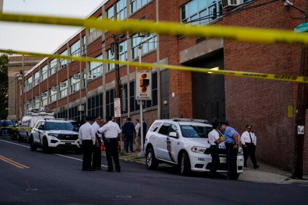 Investigators work the scene where multiple people were shot near a high school in Philadelphia on Sept. 27, 2022. (Matt Slocum/AP Photo)