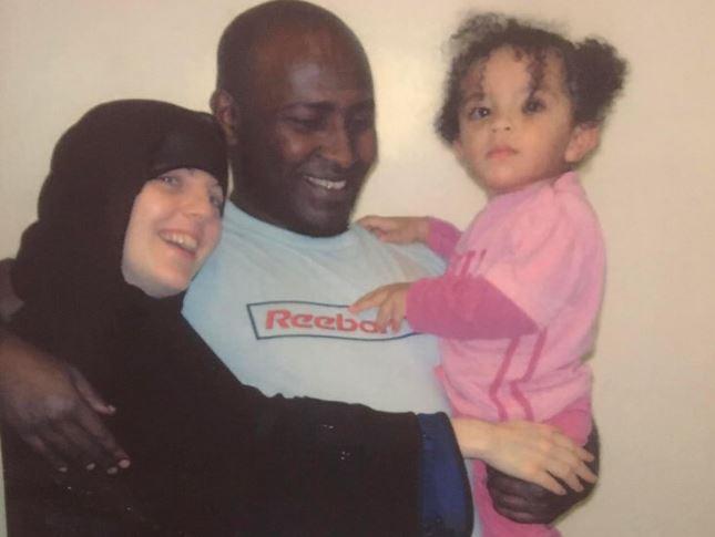 An undated photo of Bernadette Emerson, with her partner Abdullahi Suleman and their daughter, taken at a prison in England. (Courtesy of Bernadette Emerson)