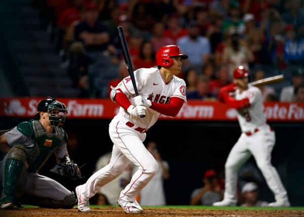 Shohei Ohtani (17) of the Los Angeles Angels singles against the Oakland Athletics in the fourth inning at Angel Stadium of Anaheim in Anaheim, Calif., on Sept. 28, 2022. (Ronald Martinez/Getty Images)