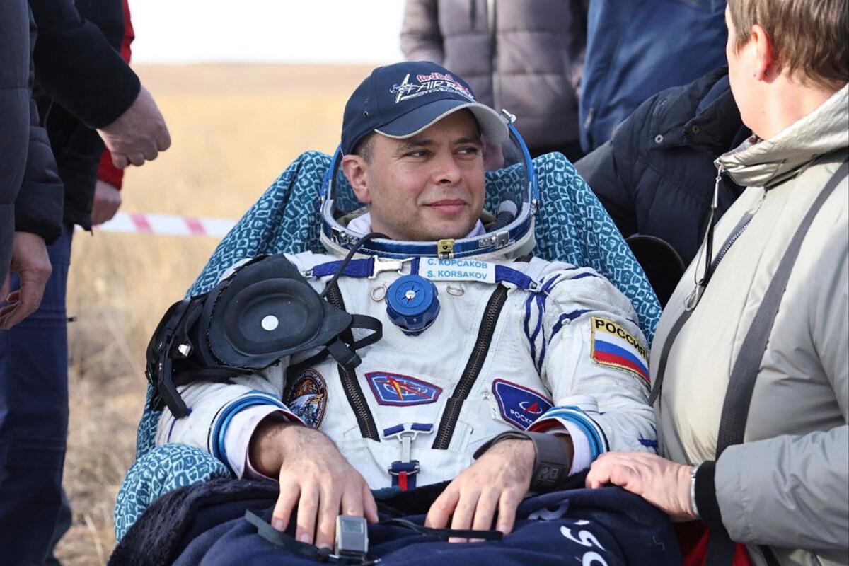 Russian cosmonaut Sergey Korsakov sits in the chair shortly after the landing of the Russian Soyuz MS-21 space capsule southeast of the Kazakh town of Zhezkazgan, Kazakhstan, on Sept. 29, 2022. (Pavel Kassin, Roscosmos State Space Corporation via AP)