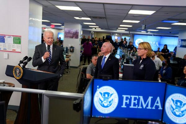 President Joe Biden (L) speaks at FEMA headquarters in Washington as Homeland Security Secretary Alejandro Mayorkasand FEMA Administrator Deanne Criswell watch, on Sept. 29, 2022. (Evan Vucci/AP Photo)